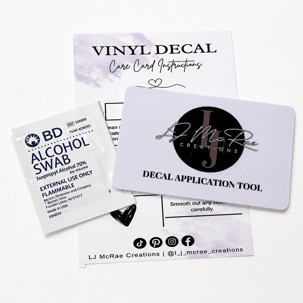 Vinyl decal application kit on a white background, including an alcohol swab packet, care card instructions, a decal application tool card, and a branded LJ McRae Creations card.